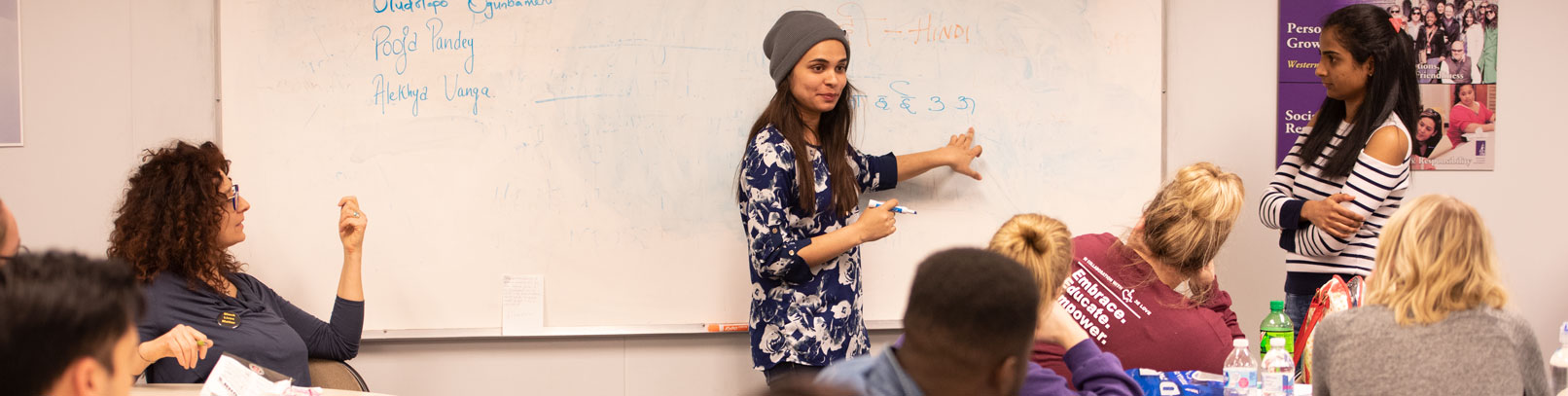 student at whiteboard practicing teaching