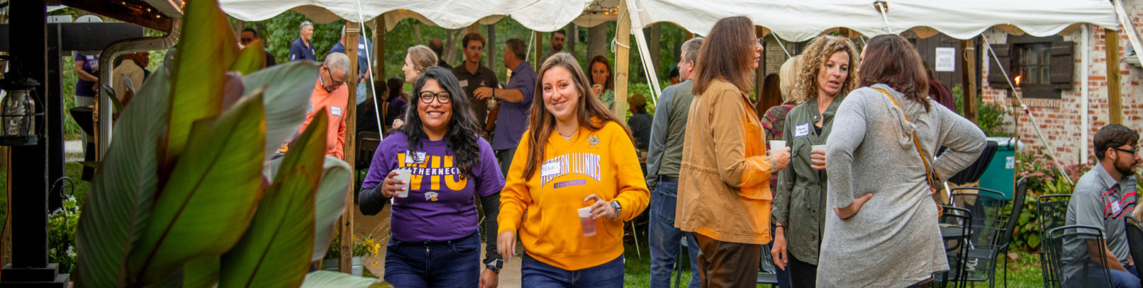 students faculty and staff at an outdoor event