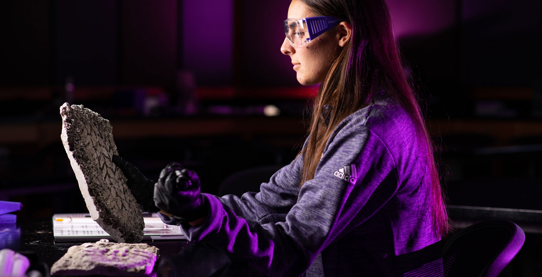 Law Enforcement Student examining tire tread in lab