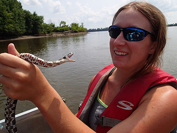 student holding a snake