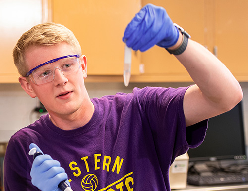 forensic chemistry student working in a lab