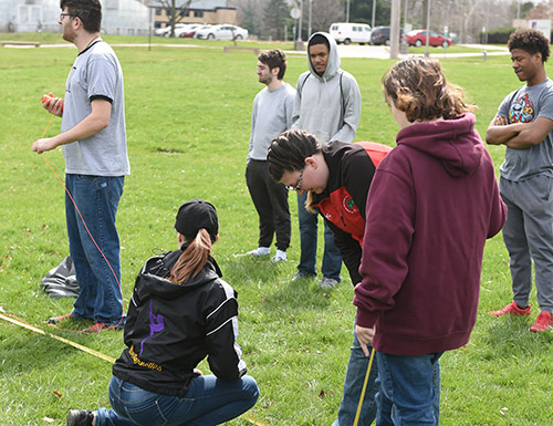 students working on a project outside