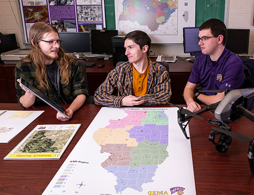 student and faculty working in a lab