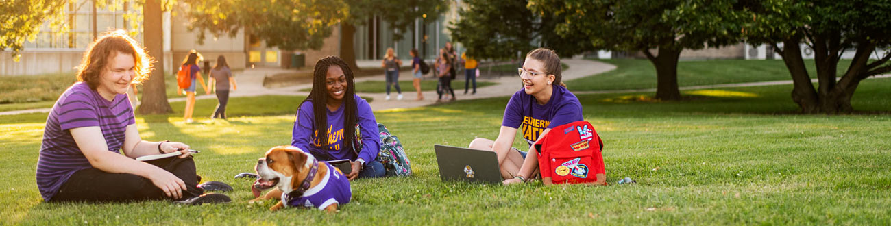 Students on campus with Mascot Ray