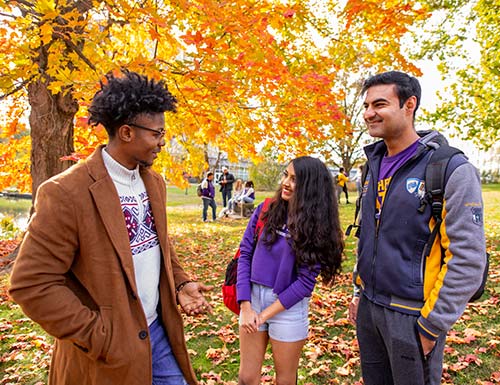 students talking on campus