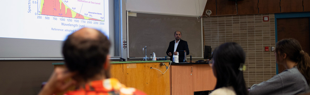 Colloquia speaker and students listening