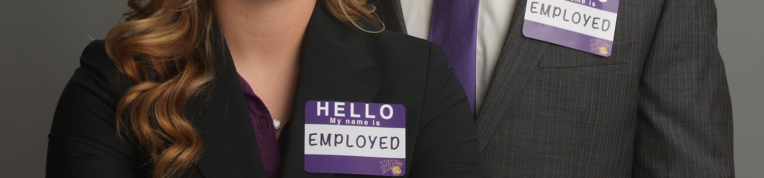 two people wearing name tags saying my name is employed