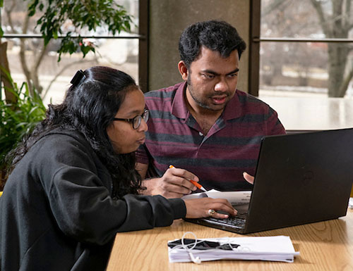 students working on computer