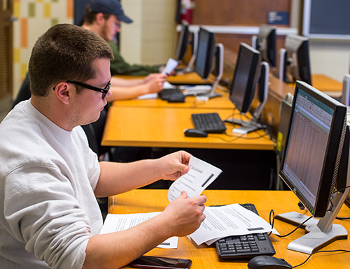 student working at a computer