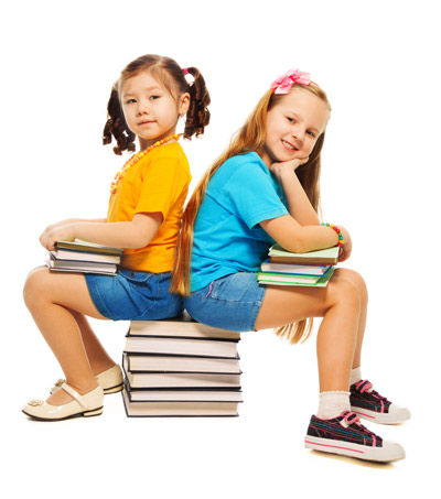 children with stacks of books