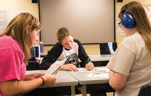 Two students studying in a classroom