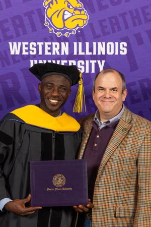 Babatunde stands with WIU Director, Institute for Environmental Studies and Institute for Environmental Studies and mentor Roger Viadero.