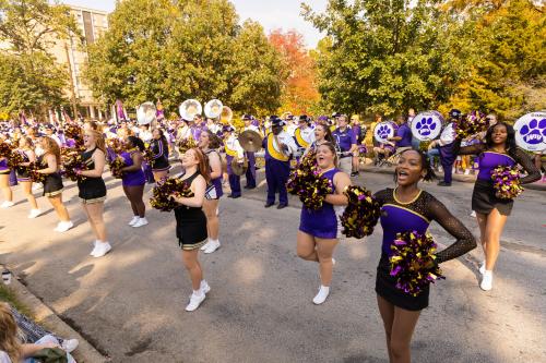 WIU Cheerleaders and band members perform during the 2024 Homecoming Parade.