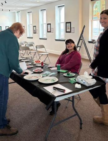 Community engagement: A participant adds finishing touches to a printmaking holiday card during the hands-on workshop facilitated by WIU Museum Studies faculty and students.