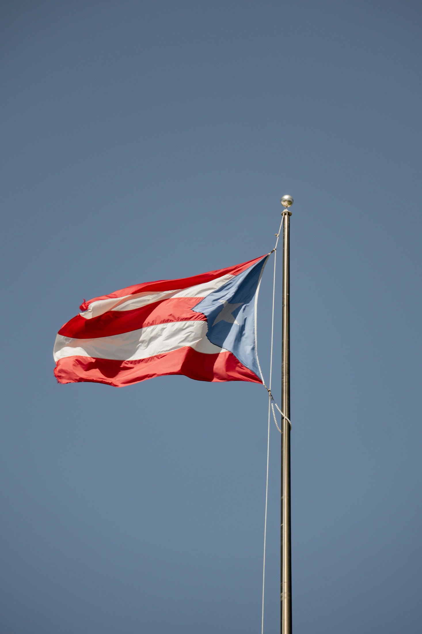 The Puerto Rican flag flying outdoors
