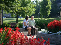 Two women siting on bench